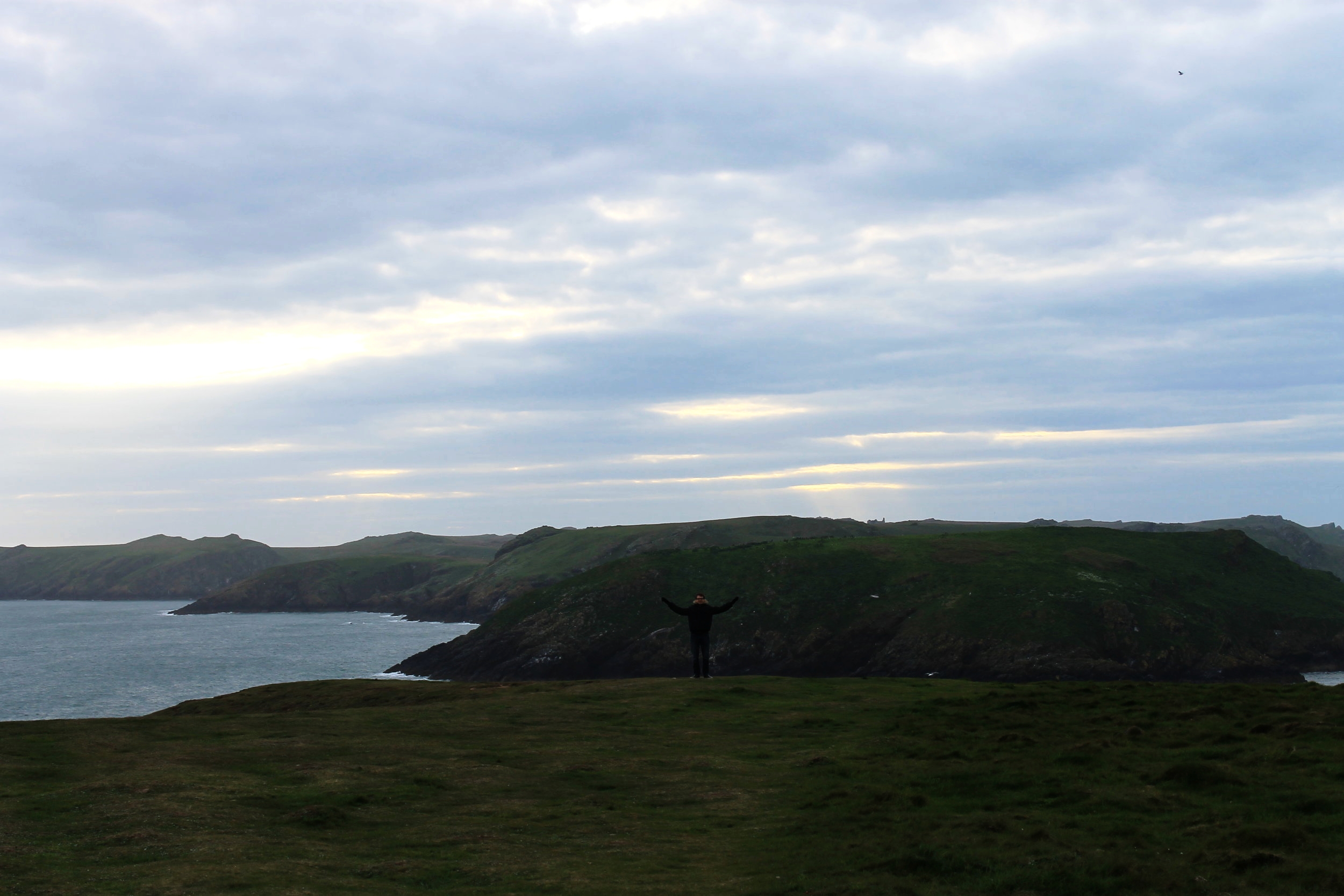 View of Skomer Island at sunset from the Pembrokeshire Coast Path near Martin's Haven